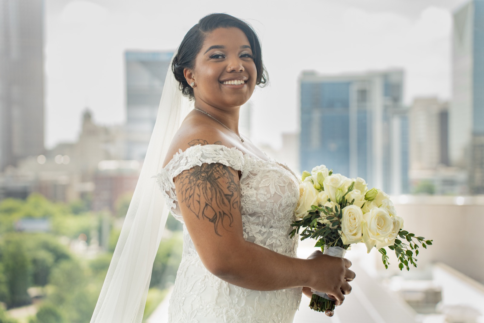 Bridal portrait with bouquet and Atlanta skyline — wedding photography by Svpreme Studios