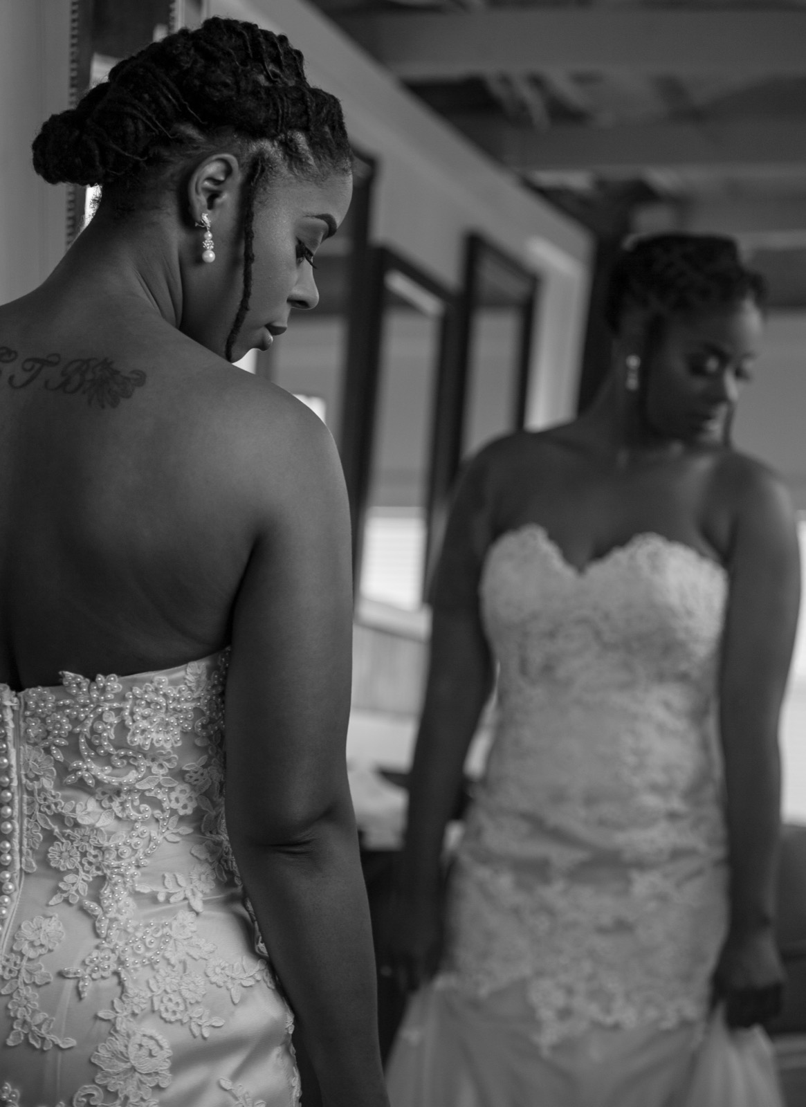 Bride getting ready in mirror — black and white Atlanta wedding photography